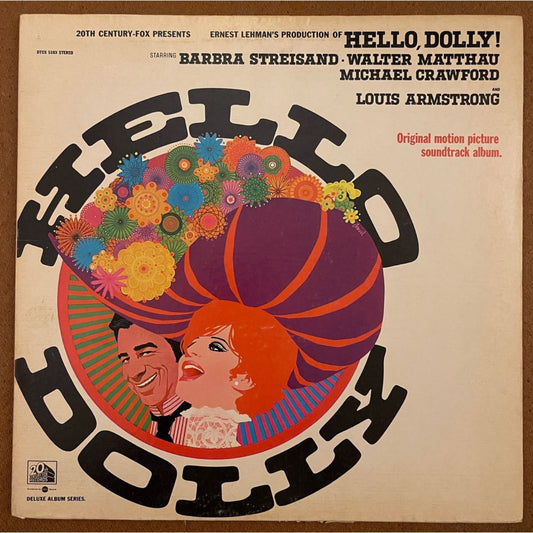 The album cover art of hello dolly with. Circular image of two heads with flowers. 