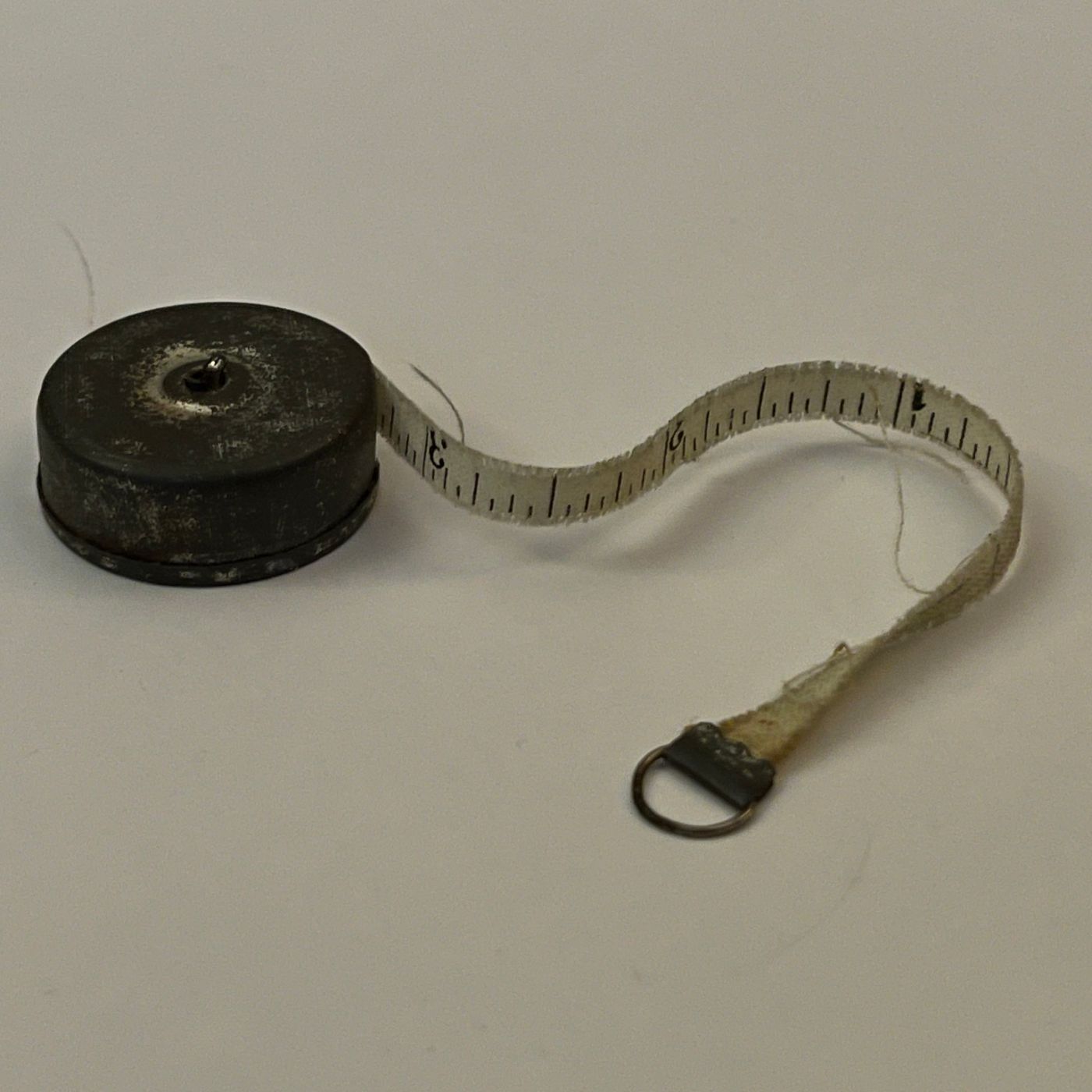 Mini Retractable Measuring Tape; by Singer Sewing Co.